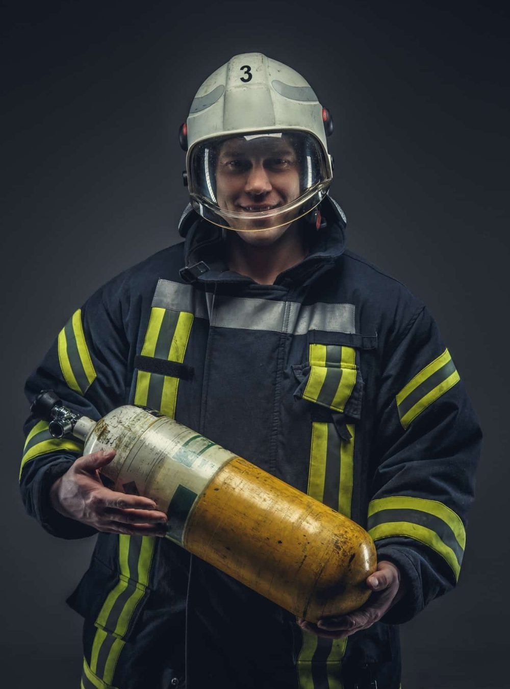Firefighter-Rescue-Holds-Yellow-Oxygen-Tank-.Jpg